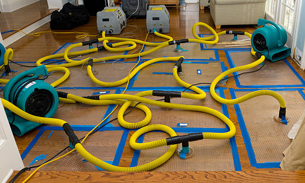 Professional Flood Damage Restoration technician working in Climax, NC